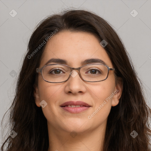 Joyful white adult female with long  brown hair and brown eyes