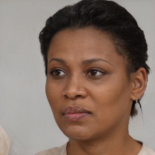 Neutral black young-adult female with short  black hair and brown eyes
