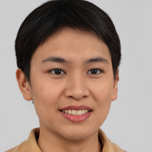 Joyful asian young-adult female with short  brown hair and brown eyes