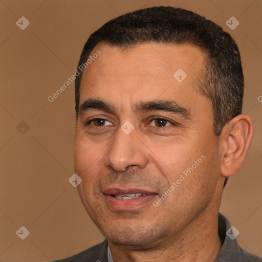 Joyful white adult male with short  black hair and brown eyes