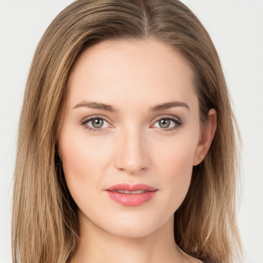 Joyful white young-adult female with long  brown hair and green eyes