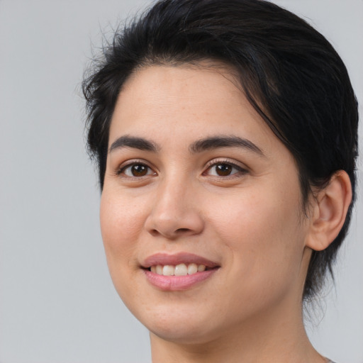 Joyful asian young-adult female with medium  brown hair and brown eyes