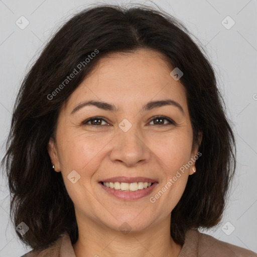 Joyful white adult female with medium  brown hair and brown eyes