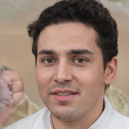 Joyful white adult male with short  brown hair and brown eyes