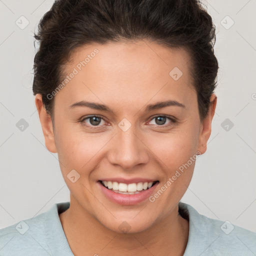 Joyful white young-adult female with short  brown hair and brown eyes