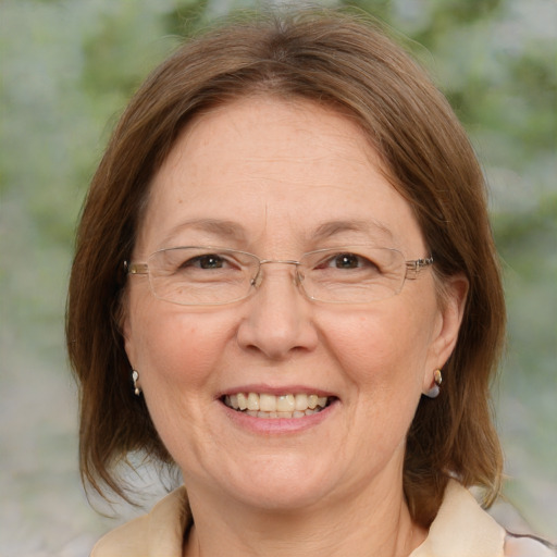 Joyful white adult female with medium  brown hair and blue eyes