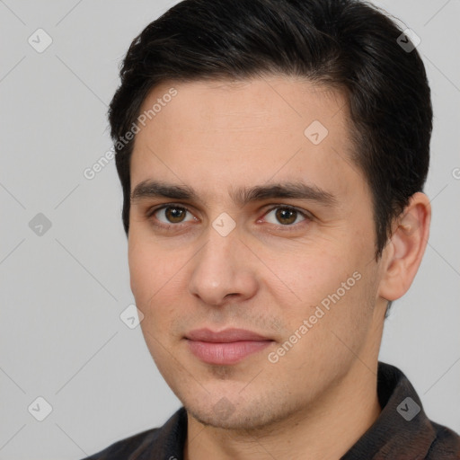 Joyful white young-adult male with short  brown hair and brown eyes