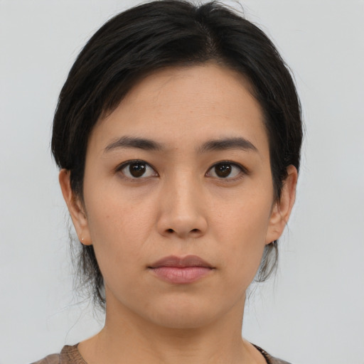 Neutral asian young-adult female with medium  brown hair and brown eyes