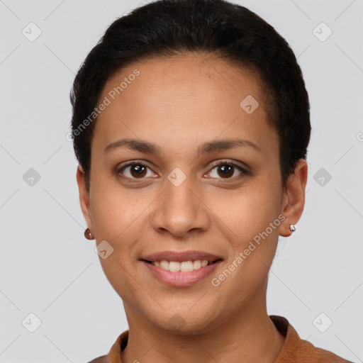 Joyful latino young-adult female with short  brown hair and brown eyes