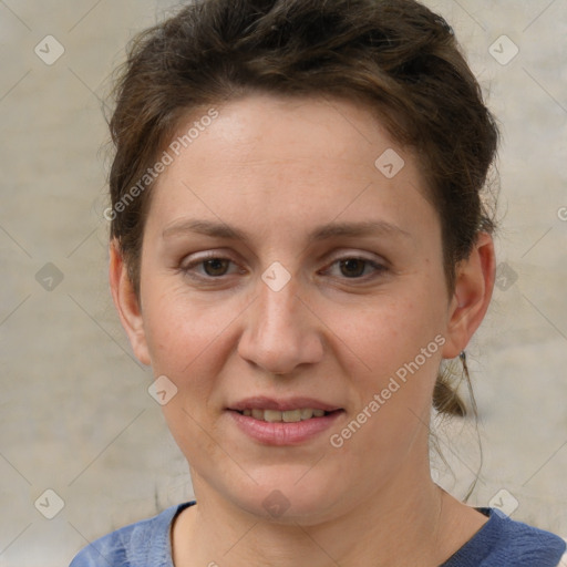 Joyful white adult female with short  brown hair and grey eyes