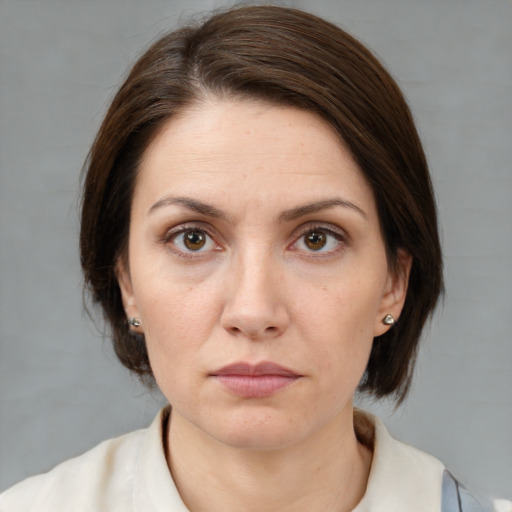 Neutral white young-adult female with medium  brown hair and brown eyes