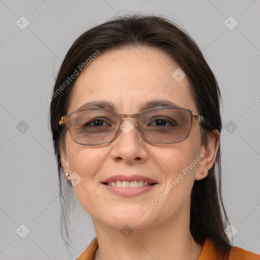 Joyful white adult female with medium  brown hair and brown eyes