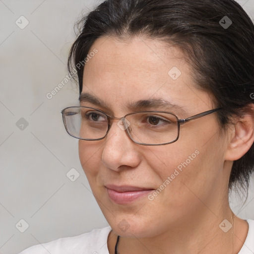 Joyful white adult female with medium  brown hair and brown eyes