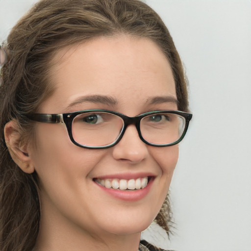 Joyful white young-adult female with long  brown hair and blue eyes