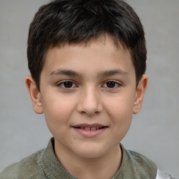 Joyful white child male with short  brown hair and brown eyes