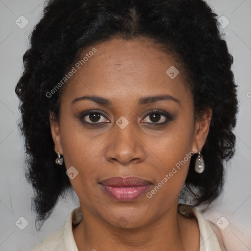 Joyful black adult female with medium  brown hair and brown eyes