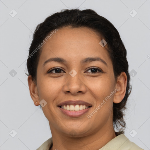 Joyful latino young-adult female with short  brown hair and brown eyes