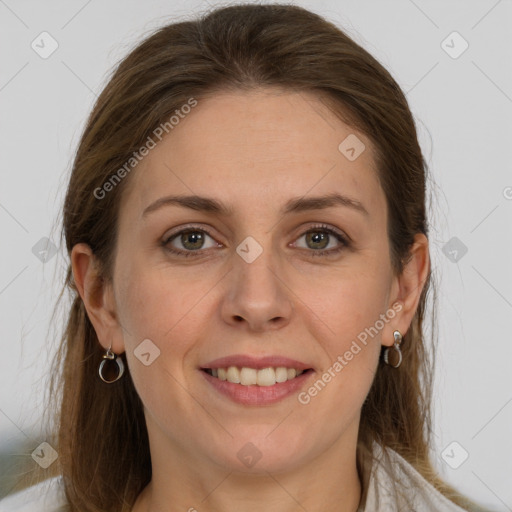 Joyful white young-adult female with long  brown hair and grey eyes