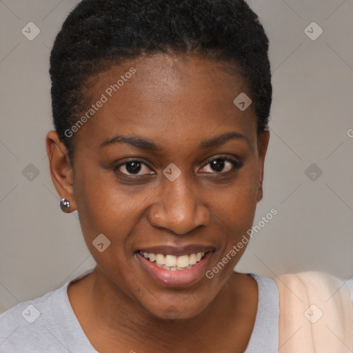 Joyful black young-adult female with short  brown hair and brown eyes