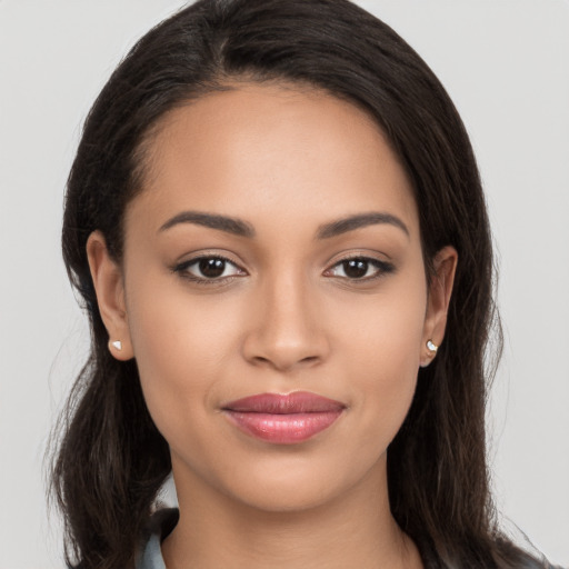 Joyful white young-adult female with long  brown hair and brown eyes