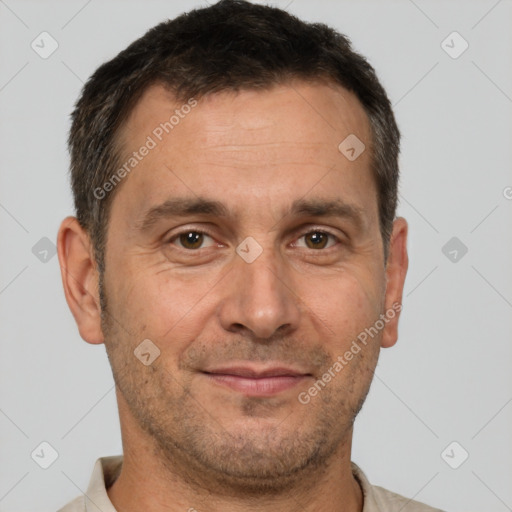 Joyful white adult male with short  brown hair and brown eyes