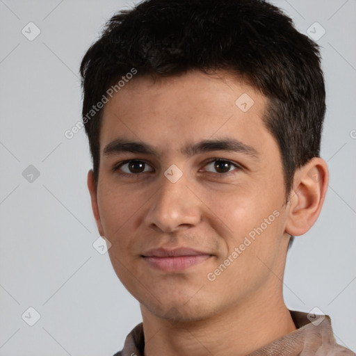 Joyful white young-adult male with short  black hair and brown eyes