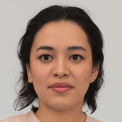 Joyful asian young-adult female with medium  brown hair and brown eyes