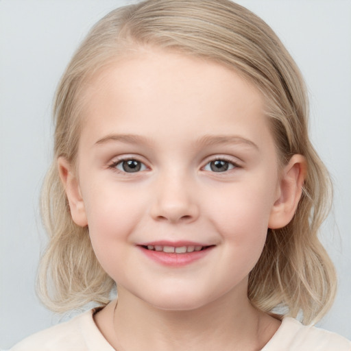 Joyful white child female with medium  brown hair and blue eyes