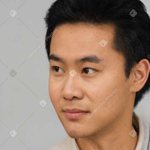 Neutral asian young-adult male with short  black hair and brown eyes