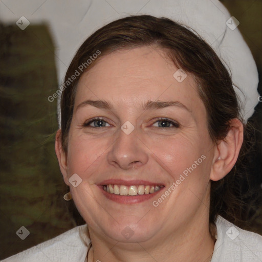 Joyful white adult female with medium  brown hair and blue eyes