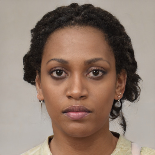 Neutral black young-adult female with medium  black hair and brown eyes