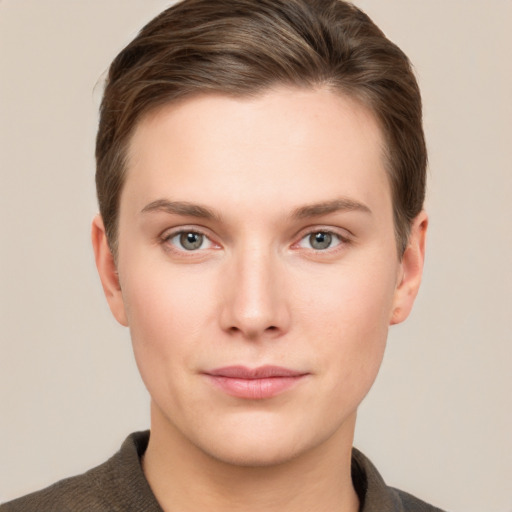 Joyful white young-adult female with short  brown hair and grey eyes