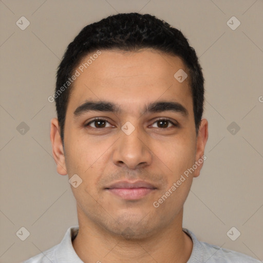 Joyful latino young-adult male with short  black hair and brown eyes