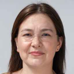 Joyful white adult female with medium  brown hair and brown eyes