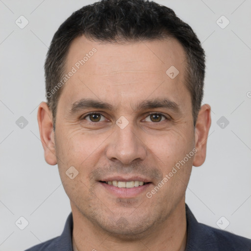 Joyful white adult male with short  brown hair and brown eyes