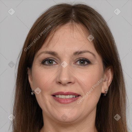 Joyful white adult female with long  brown hair and brown eyes