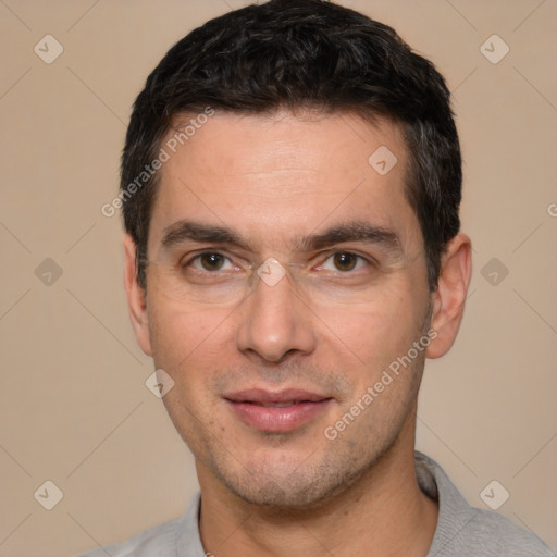 Joyful white young-adult male with short  black hair and brown eyes