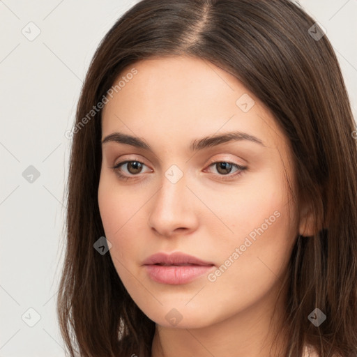 Neutral white young-adult female with long  brown hair and brown eyes