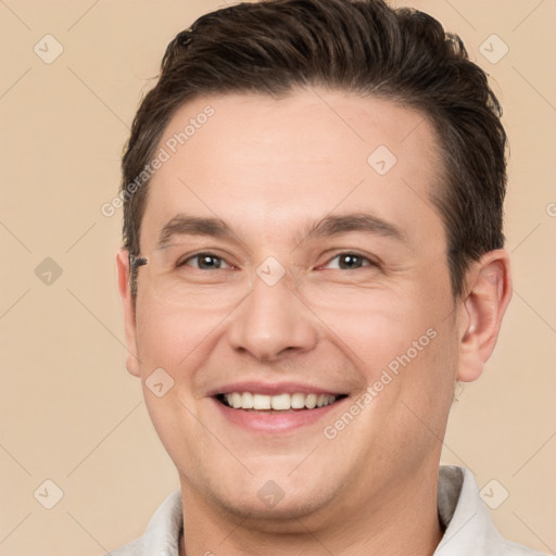 Joyful white adult male with short  brown hair and brown eyes