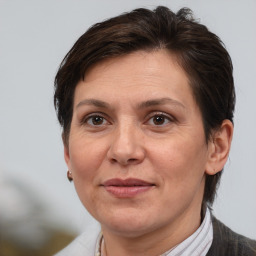 Joyful white adult female with short  brown hair and brown eyes