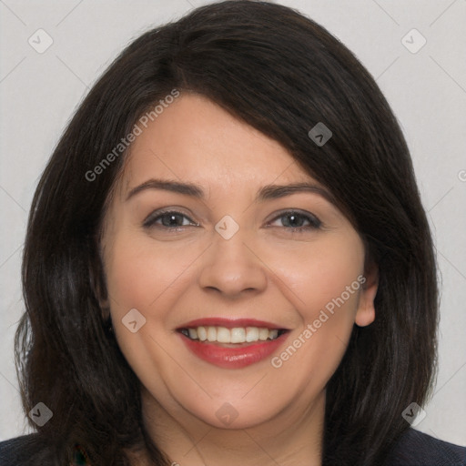 Joyful white young-adult female with long  brown hair and brown eyes