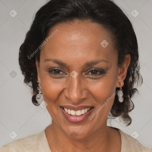 Joyful black adult female with medium  brown hair and brown eyes