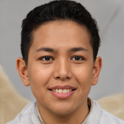 Joyful latino young-adult male with short  brown hair and brown eyes