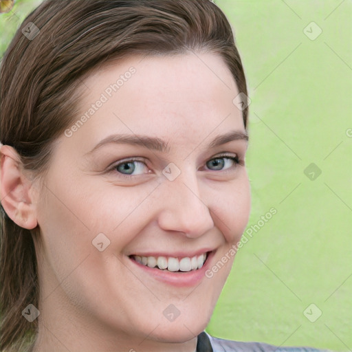 Joyful white young-adult female with medium  brown hair and blue eyes