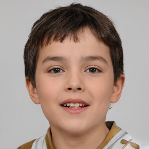 Joyful white child male with short  brown hair and brown eyes