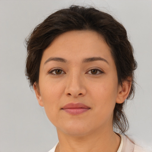 Joyful white young-adult female with medium  brown hair and brown eyes
