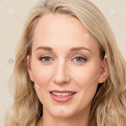 Joyful white young-adult female with long  brown hair and blue eyes