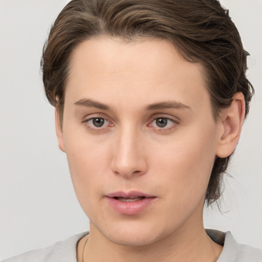 Neutral white young-adult female with short  brown hair and brown eyes