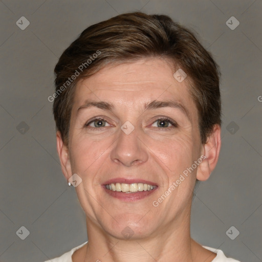 Joyful white adult female with short  brown hair and grey eyes