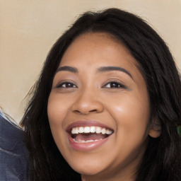 Joyful latino young-adult female with long  black hair and brown eyes